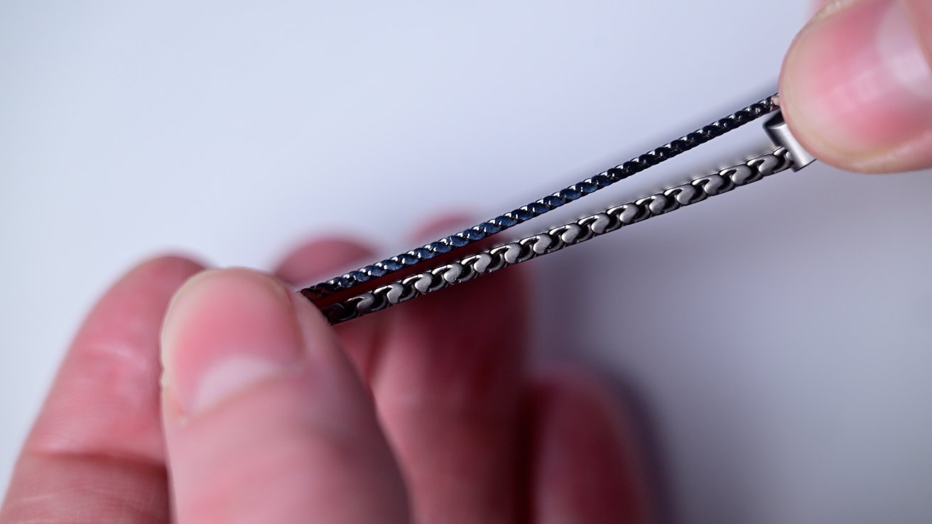 Two metal watch bands showing their thickness
